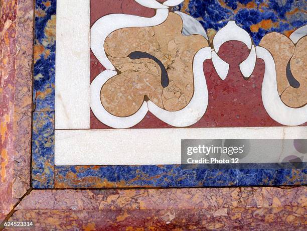 Detail from a 19th century marble table from Italy. Using colourful floral inlays to create the design.