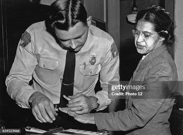 Rosa Parks is fingerprinted by police Lt. D.H. Lackey in Montgomery, 1956.