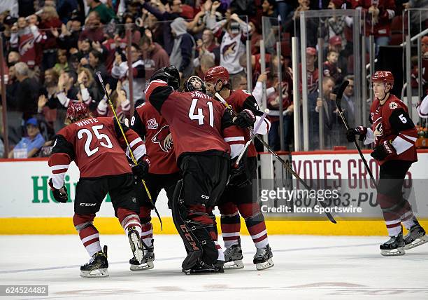 Arizona Coyotes center Ryan White , goalie Mike Smith , and teammates react after defeating the San Jose Sharks 3-2 in overtime on November 19 at...
