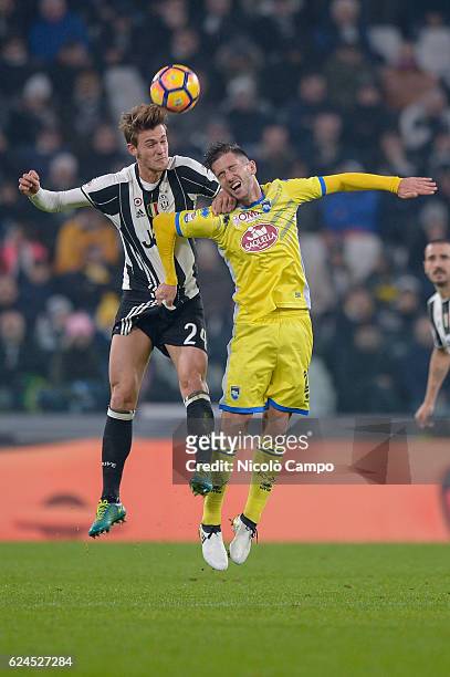 Daniele Rugani of Juventus FC and Stefano Pettinari of Pescar Calcio compete for the ball during the Serie A football match between Juventus FC and...