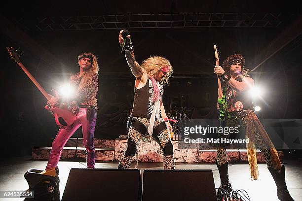 Lexxi Foxx, Michael Starr and Satchel of Steel Panther perform on stage at Showbox SoDo on November 19, 2016 in Seattle, Washington.