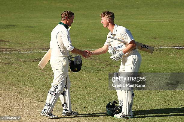 George Bailey and Jordan Silk of Tasmania shake hands after winning on day four of the Sheffield Shield match between Western Australia and Tasmania...