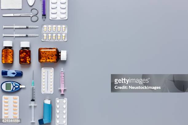 medical equipment arranged on gray background - knolling concept - diabetes pills stock pictures, royalty-free photos & images