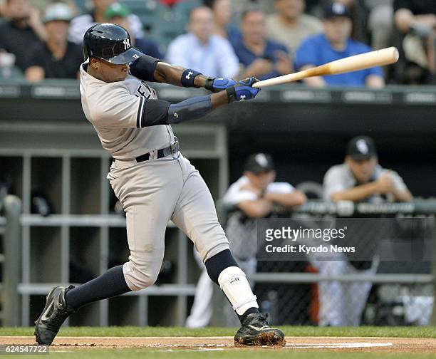 United States - New York Yankees outfielder Alfonso Soriano hits a two-run homer during the first inning of a game against the Chicago White Sox at...