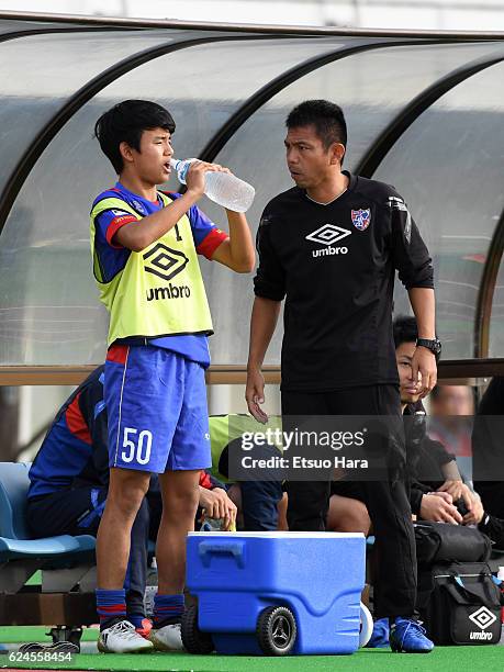 Coach Tadashi Nakamura of FC Tokyo U-23 speaks to Takefusa Kubo#50 during the J.League third division match between FC Tokyo U-23 and Cerezo Osaka...