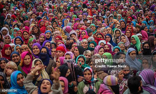 Kashmiri Muslim women attend the funeral of Rayees Ahmad, a pro Kashmir rebel killed in a gun battle with Indian government forces, is being consoled...