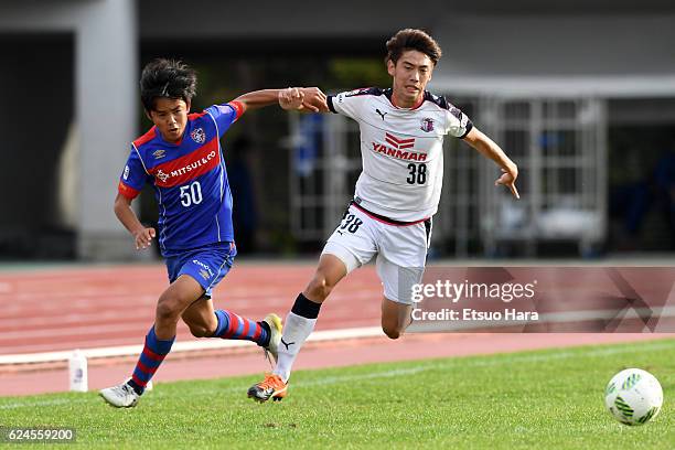 Takefusa Kubo of FC Tokyo U-23 and Masataka Nishimoto#38 of Cerezo Osaka U-23 compete for the ball during the J.League third division match between...