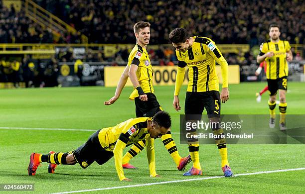 Pierre-Emerick Aubameyang of Borussia Dortmund celebrates with team mates doing press-ups after scoring his team's first goal during the Bundesliga...