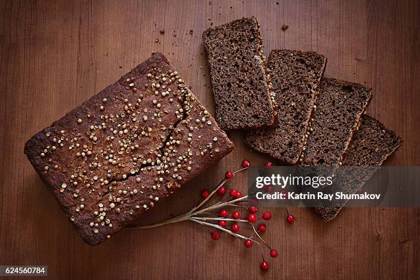 homemade gluten-free dark brown bread - gluten free bread stockfoto's en -beelden