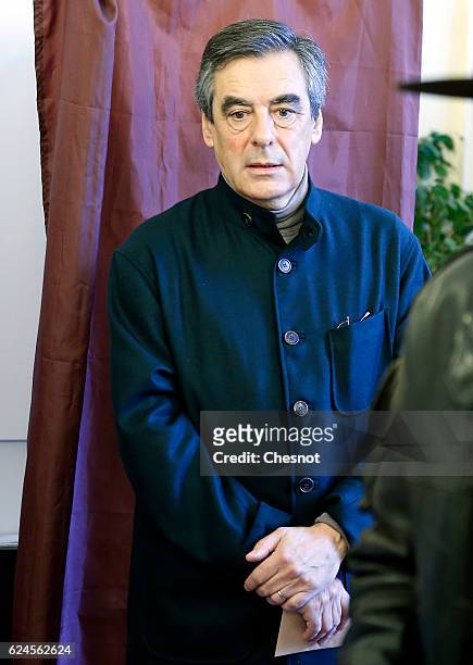 Former French Prime Minister and presidential candidate hopeful Francois Fillon votes during the first round of voting in the Republican Party's...