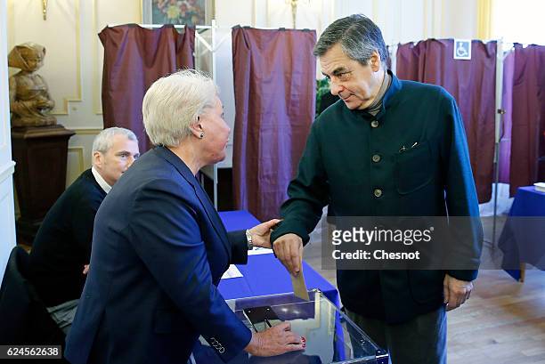 Former French Prime Minister and presidential candidate hopeful Francois Fillon votes during the first round of voting in the Republican Party's...