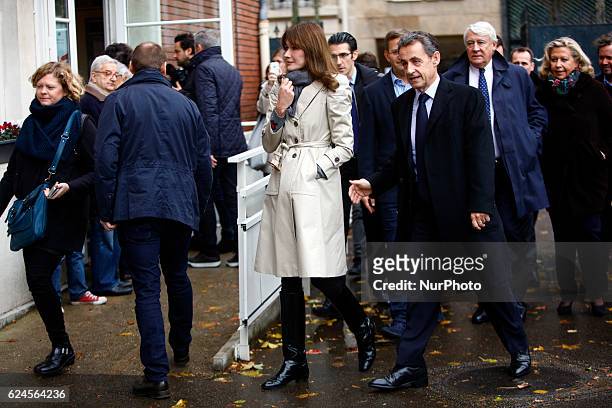 Nicolas Sarkozy and his wife Carla Bruni-Sarkozy and LR deputy Claude Goasguen , arrive to vote at a polling station in Paris, on November 20, 2016...