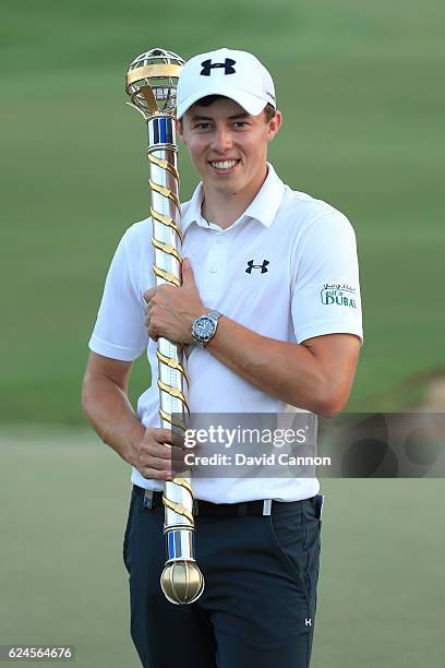 Matt Fitzpatrick of England poses with the trophy following his victory during day four of the DP World Tour Championship at Jumeirah Golf Estates on...