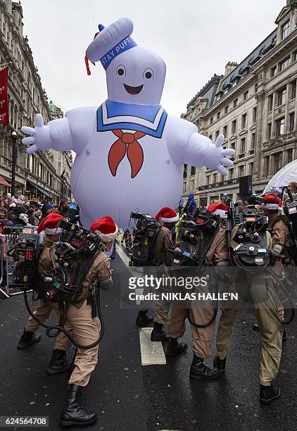 Performers dressed as characters from the movie Ghostbusters participate in the Hamleys Christmas Toy Parade on Regent Street in London on November...