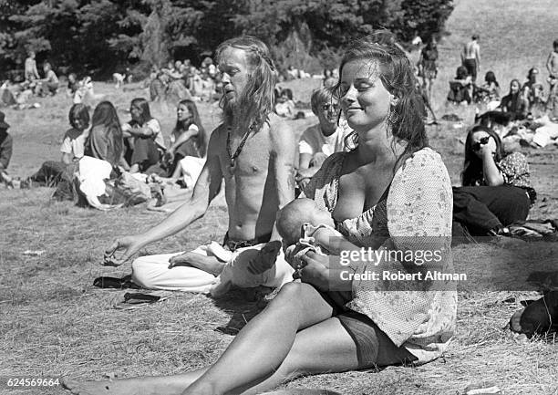 Mother is nursing her baby during a Monday Night Class picnic at Mt. Tamalpais on September 30, 1969 in San Francisco, California.