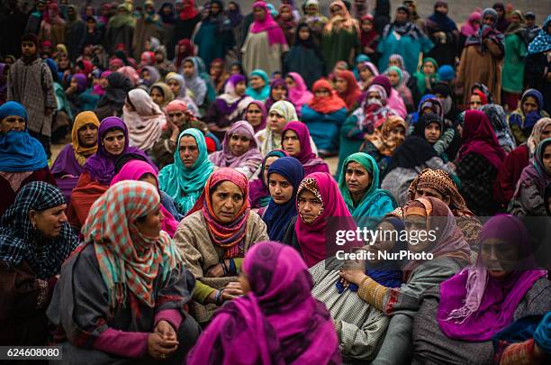 Sister of Rayees Ahmad, a militant who was killed in a gun battle with the Indian government forces, is being consoled by neighbors and relatives...