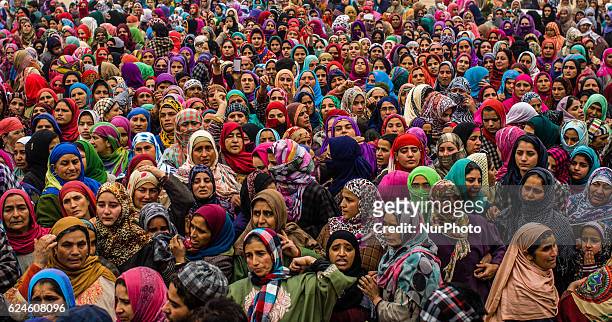 Kashmiri Muslim women attend the funeral of Rayees Ahmad, a militant who was killed in a gun battle with the Indian government forces, during his...