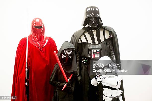 Star Wars Imperial family of cosplayer dressed as an Emperors Royal Guardsmen, Kylo Ren, Darth Vader and a Stormtrooper on day 2 of the November...