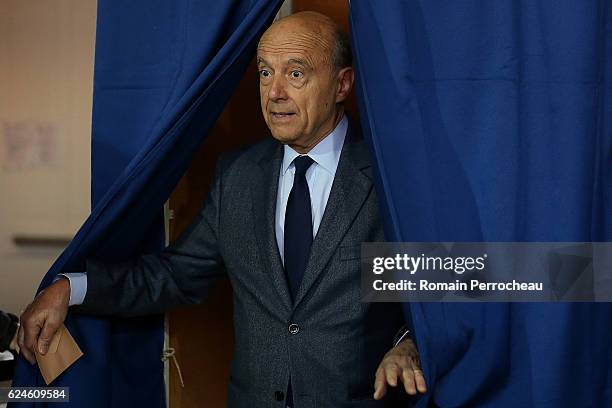 Alain Juppe, Mayor of Bordeaux and Les Republicains presidential candidate hopeful votes during the first round of voting in the Republican Party's...