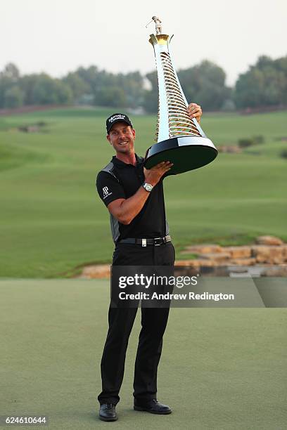 Henrik Stenson of Sweden poses with the Race to Dubai trophy during day four of the DP World Tour Championship at Jumeirah Golf Estates on November...