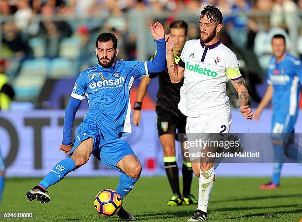 Riccardo Saponara of Empoli Fc for the ball with Gonzalo Rodriguez of ACF Fiorentina during the Serie A match between Empoli FC and ACF Fiorentina at...