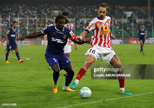 Chennaiyin FC Defender Bernard Mendy vies for the ball with Atletico De Kolkata midfielder Borja Fernandez during the Indian Super League football...