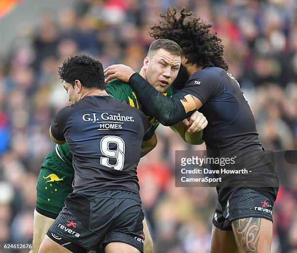 Australia's Shannon Boyd is tackled by New Zealand's Issac Luke during the Four Nations match between the New Zealand Kiwis and Australian Kangaroos...