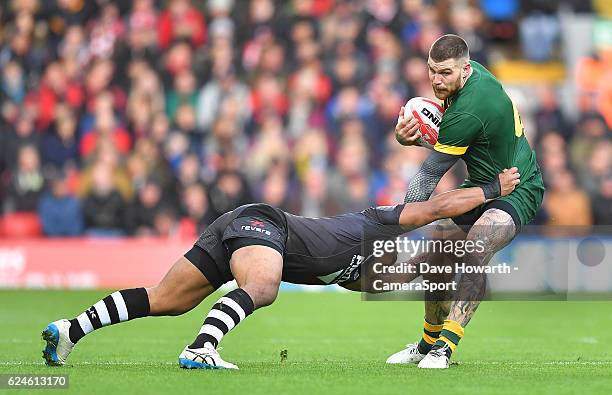 Australia's Josh Dugan is tackled during the Four Nations match between the New Zealand Kiwis and Australian Kangaroos at Anfield on November 20,...