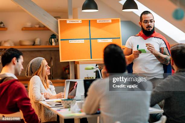 business presentation in their home office. - swot stock pictures, royalty-free photos & images