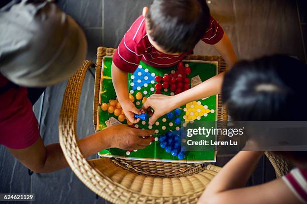 family play chinese checkers - asian games day 3 stock-fotos und bilder