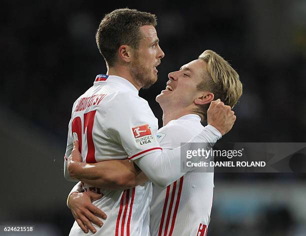 Hamburg's midfielder Nicolai Mueller celebrates scoring the 2-2 goal with Hamburg's midfielder Lewis Harry Holtby during the German first division...