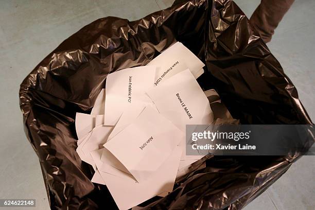 Ballot papers fill a bin during the first round of voting in the Republican Party's primary elections at a polling station on November 20, 2016 in...