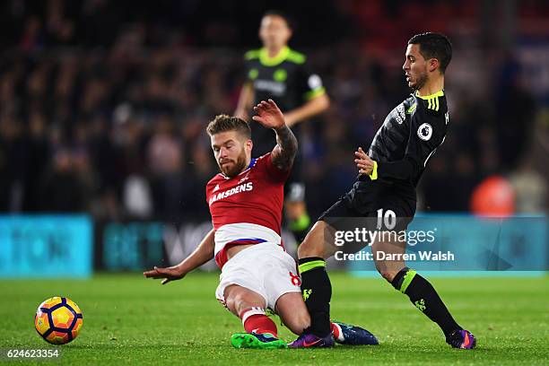 Eden Hazard of Chelsea is tackled by Adam Clayton of Middlesbrough during the Premier League match between Middlesbrough and Chelsea at Riverside...