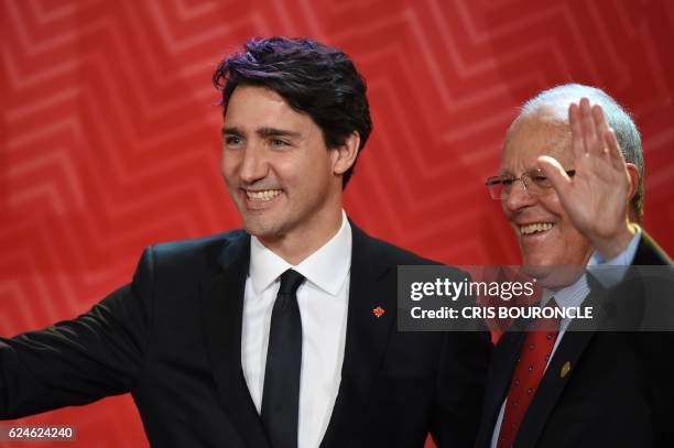 Canada's Prime Minister Justin Trudeau shakes hands with Peru's President Pedro Pablo Kuczynski upon arrival to attend the Leaders' Retreat of the...