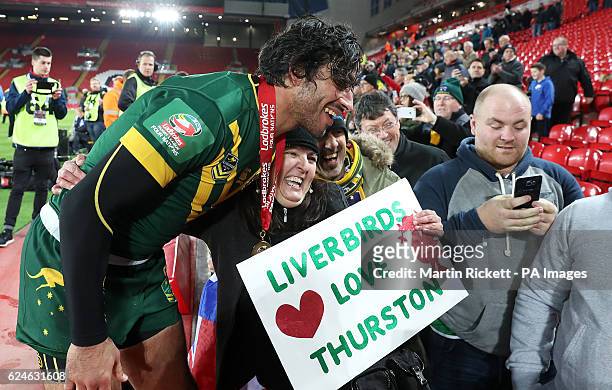Australia's Jonathan Thurston poses for a photograph with a fan after the Final of the Ladbrokes Four Nations Championship at Anfield, Liverpool.