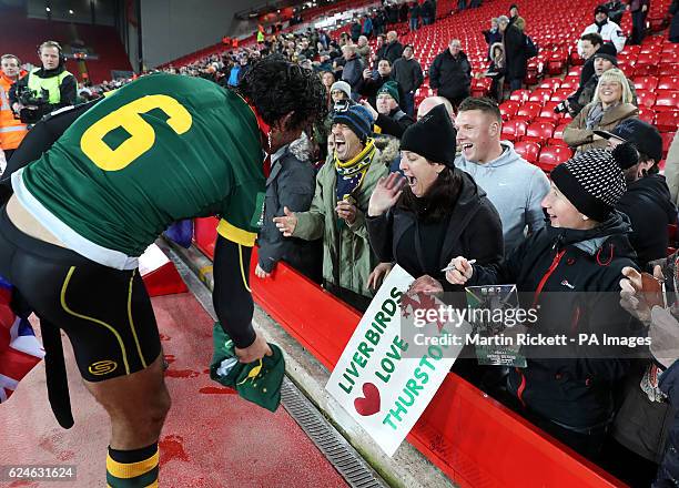 Australia's Jonathan Thurston gives his shorts to a fan after the Final of the Ladbrokes Four Nations Championship at Anfield, Liverpool.