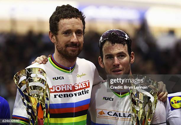 Sir Bradley Wiggins and Mark Cavendish of Great Britain and Team John Saey - Callant pose with their trophies after victory during the final day of...