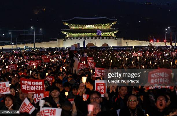 People hold candlelight with shout slogans during a anti-Government rally at Gwanghwamoon square in Seoul, South Korea. For the fourth straight...