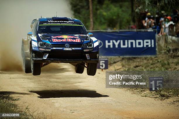 Sebastien Ogier and co-driver Julien Ingrassia power their Volkswagen Motorsport Polo R over a flat-out jump during the final day of Rally Australia,...