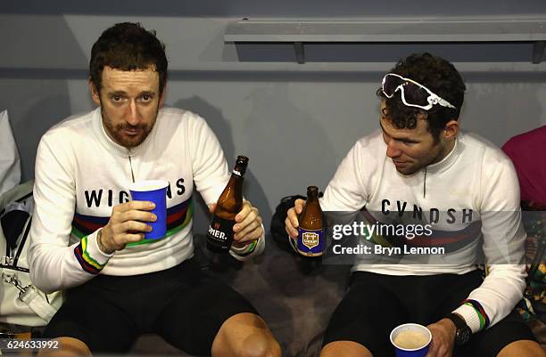 Sir Bradley Wiggins and Mark Cavendish of Great Britain and Team John Saey - Callant celebrate victory with a drink after the final day of the 76th 6...