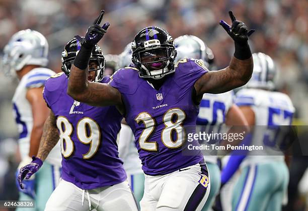 Terrance West of the Baltimore Ravens celebrates after rushing for a touchdown during the first quarter against the Dallas Cowboys at AT&T Stadium on...