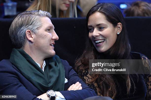 Bastian Schweinsteiger and Ana Ivanovic attend the Singles Final between Novak Djokovic of Serbia and Andy Murray of Great Britain at the O2 Arena on...
