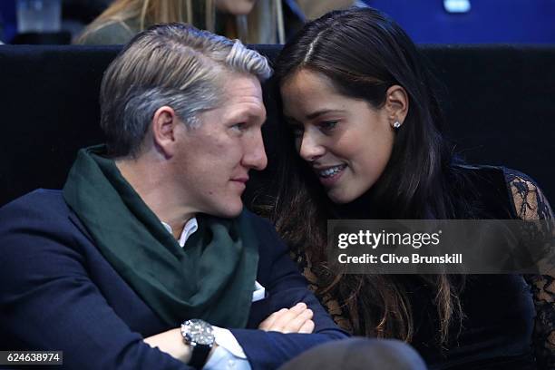 Bastian Schweinsteiger and Ana Ivanovic attend the Singles Final between Novak Djokovic of Serbia and Andy Murray of Great Britain at the O2 Arena on...