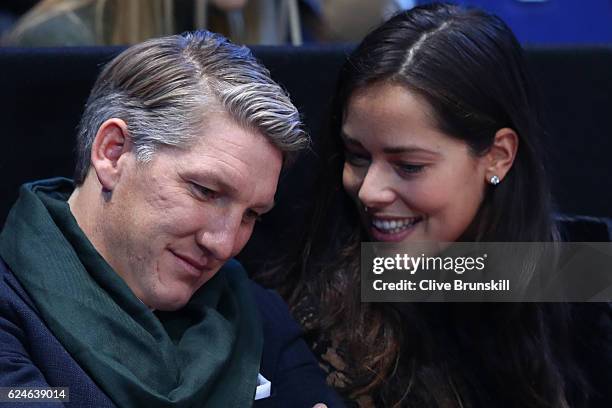 Bastian Schweinsteiger and Ana Ivanovic attend the Singles Final between Novak Djokovic of Serbia and Andy Murray of Great Britain at the O2 Arena on...