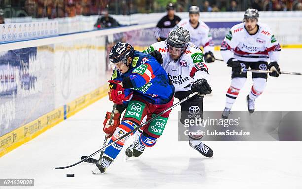 Alexander Preibisch of Duesseldorf and Nickolas Latta of Koeln in action during the DEL match between Duesseldorfer EG and Koelner Haie at ISS Dome...