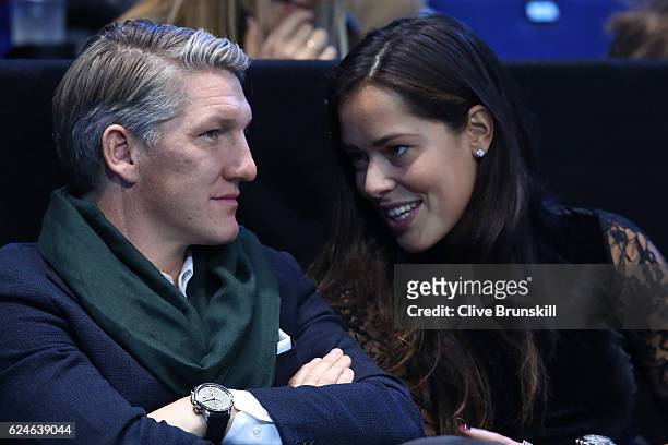 Bastian Schweinsteiger and Ana Ivanovic attend the Singles Final between Novak Djokovic of Serbia and Andy Murray of Great Britain at the O2 Arena on...