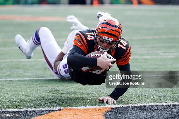Andy Dalton of the Cincinnati Bengals scores a touchdown during the first quarter of the game against the Cincinnati Bengals at Paul Brown Stadium on...