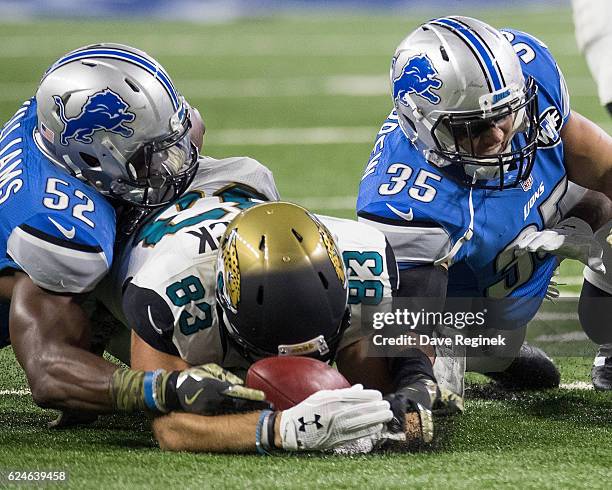 Ben Koyack of the Jacksonville Jaguars recovers a fumbled punt in front of Miles Killebrew and Antwione Williams of the Detroit Lions during an NFL...