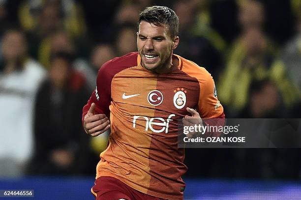 Galatasaray's German forward Lukas Podolsky reacts during the Turkish Super Lig football match between Fenerbahce and Galatasaray at the Fenerbahce...