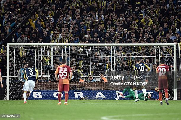 Fenerbahce`s Dutch forward Robin Van Persie scores a goal during the Turkish Super Lig football match between Fenerbahce and Galatasaray at the...